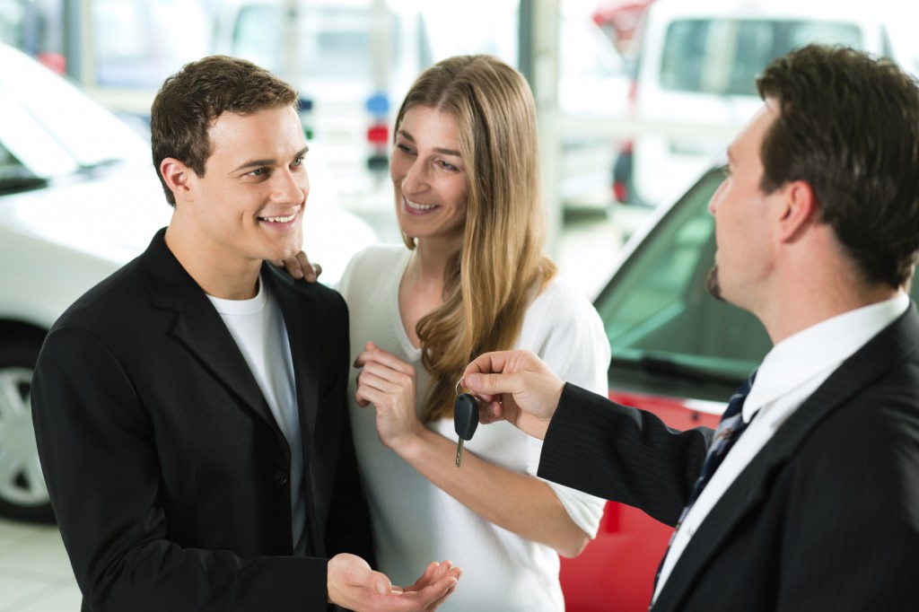 Properly Trained Salesperson Handing Over Keys